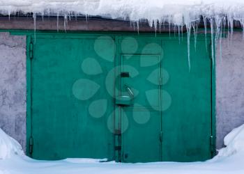 Royalty Free Photo of a Set of Green Gates in Snow