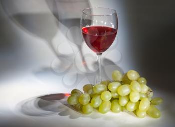 Royalty Free Photo of a Glass of Wine and Grapes