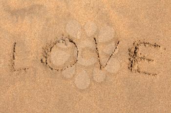 Royalty Free Photo of Love Written in Sand