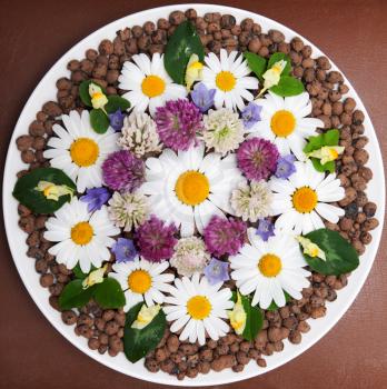 Royalty Free Photo of a Plate of Flowers