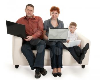 Royalty Free Photo of a Family Sitting With Laptops
