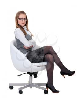 Royalty Free Photo of a Girl Sitting in a Chair