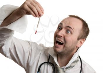 Royalty Free Photo of a Doctor Looking at a Thermometer
