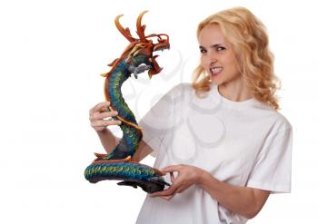 Royalty Free Photo of a Woman Holding a Wooden Dragon