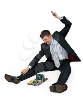 Royalty Free Photo of a Businessman Breaking a Computer With a Hammer