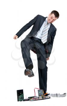 Royalty Free Photo of a Businessman Trampling on a Computer