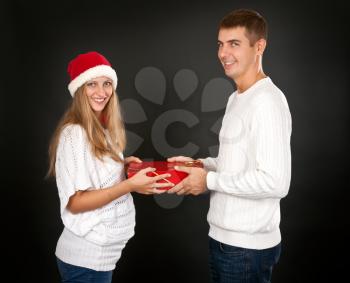Royalty Free Photo of a Couple Exchanging a Present
