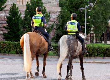 Royalty Free Photo of Two Female Police Officers on Horses in Helsinki, Finland