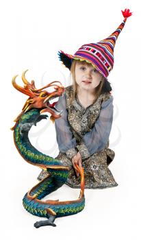 Royalty Free Photo of a Little Girl With a Dragon Statue
