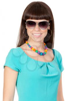 Fashionable young woman wearing sunglasses and a blue dress close-up. Isolate on white