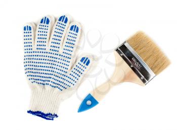 Cotton gloves with blue rubber inserts and a new 100 mm brush to paint. Isolate on white.