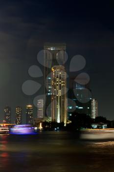View of the Bangkok night across the river Chao Phraya