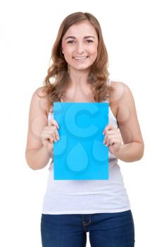 beautiful girl behind empty blue board smiling. isolate on white