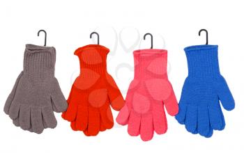 Four pairs of colorful gloves on a white background