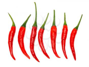 Seven Red hot chili pepper on a white background stacked