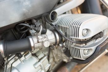 Internal combustion engine motorcycle close up.