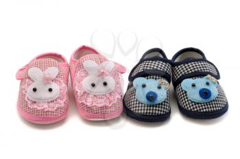 Two pairs of baby shoes, pink and blue. Isolate on white.