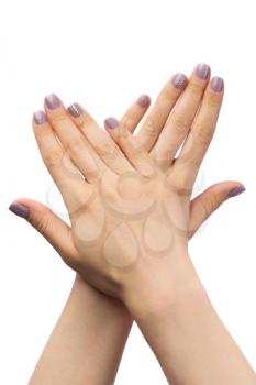 Women's hands, purple manicure with rhinestones. Isolate on white.