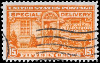 Royalty Free Photo of a 1931 US Stamp of a Postman and Motorcycle