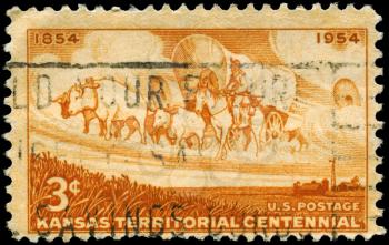 Royalty Free Photo of 1954 US Stamp of a Wheat Field and Pioneer Wagon Train, Establishment of the Kansas Territory
