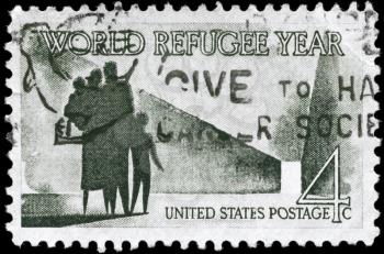 Royalty Free Photo of 1960 US Stamp Shows the Refugee Family, World Refugee Year Issue