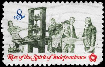 Royalty Free Photo of 1973 US Stamp Shows the Printer and Patriots Examining Pamphlet, Rise of the Spirit of Independence