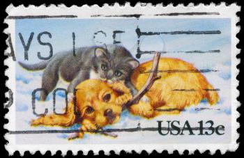 Royalty Free Photo of 1982 US Stamp With a Kitten and Puppy