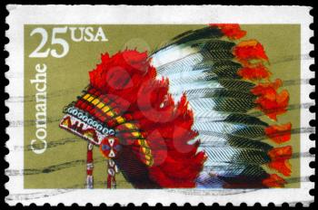 Royalty Free Photo of 1990 US Stamps Shows the Indian Headdresses of the Tribe Comanche