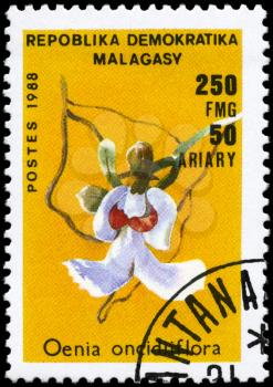 MALAGASY REPUBLIC - CIRCA 1988: A Stamp printed in MALAGASY REPUBLIC shows image of a Oenia oncidiflora, from the series Orchids, circa 1988