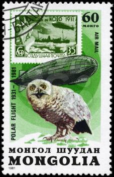 MONGOLIA - CIRCA 1981: A Stamp printed in MONGOLIA shows the image of the Graf Zeppelin & Snowy Owl from the series Polar Flight 1931-1981, circa 1981