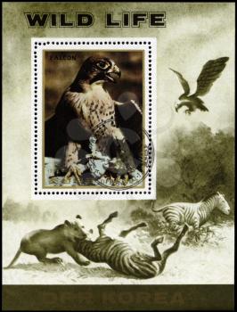 NORTH KOREA - CIRCA 1984: A Stamp sheet printed in NORTH KOREA shows image of 
a Eagle and Lion preying on Zebra from the series Wild Animals, circa 1984