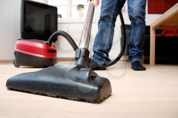 Royalty Free Photo of a Person Vacuuming