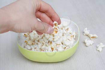 Royalty Free Photo of a Person Eating Popcorn