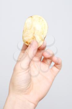 Royalty Free Photo of a Person Holding a Chip