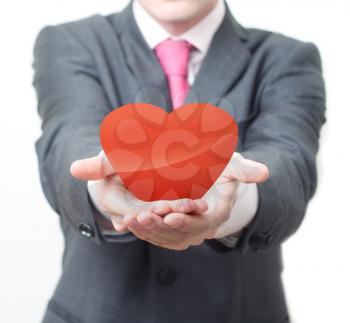 Royalty Free Photo of a Businessman Holding a Heart