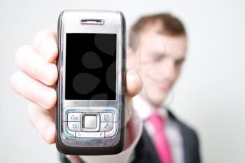 Royalty Free Photo of a Businessman Holding a Cellphone