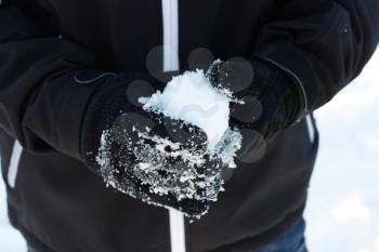 Royalty Free Photo of a Person Making a Snowball