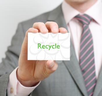 Royalty Free Photo of a Businessman Holding a Recycle Card