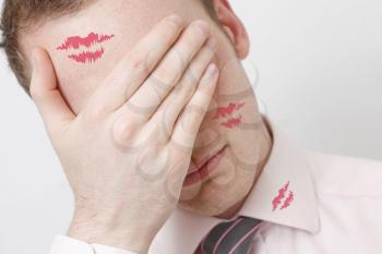 Royalty Free Photo of a Businessman With Lipstick Marks