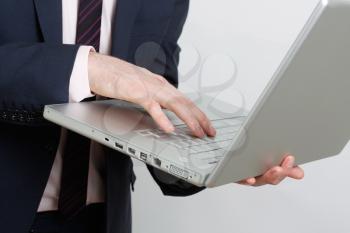 Royalty Free Photo of a Businessman Using a Laptop