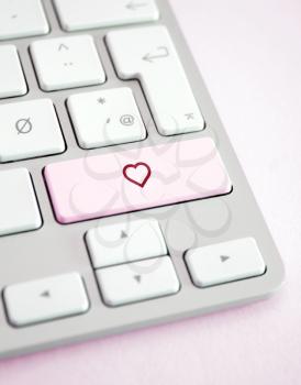 Royalty Free Photo of a Heart on a Keyboard