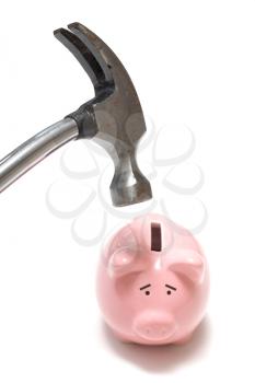 Royalty Free Photo of a Hammer Destroying a Piggy Bank