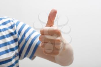 Royalty Free Photo of a Person Giving a Thumbs Up