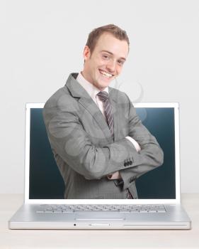 Royalty Free Photo of a Businessman in a Computer 