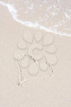 Royalty Free Photo of a Heart in the Sand on the Beach
