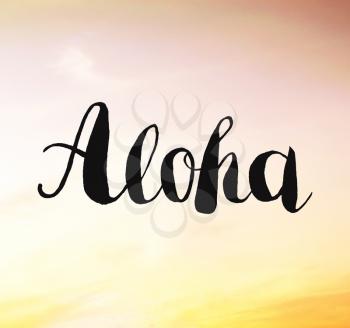 Aloha written on sunset