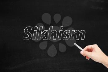 Sikhism written on a blackboard