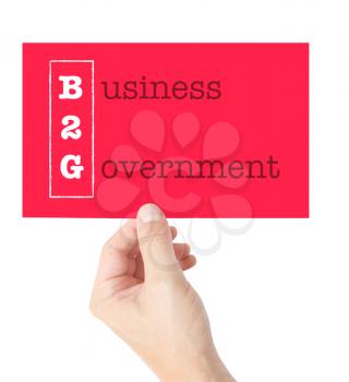 Business 2 Government explained on a card held by a hand