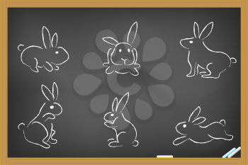 Royalty Free Clipart Image of Rabbits on a Chalkboard