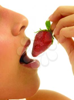 Royalty Free Photo of a Woman Eating a Strawberry